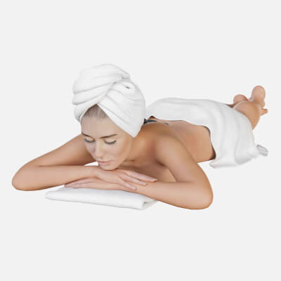 Woman in White Towels Relaxing in a Spa